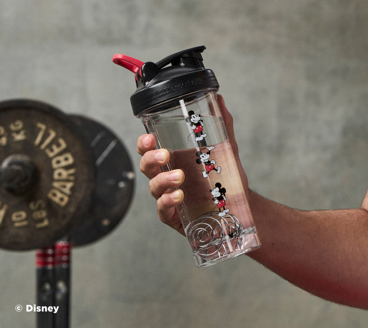 pro-series-b4 Mickey_Mouse_Protein_Shaker_Bottle_Being_Held_In_the_Gym.jpg